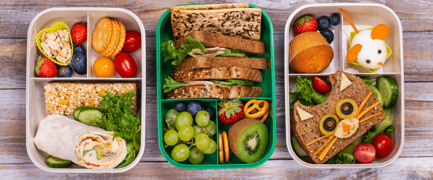 Three lunchboxes with healthy, colourful kids lunches inside