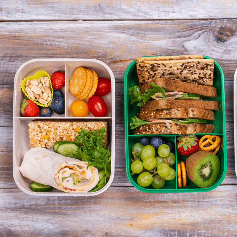 Two lunchboxes with colourful healthy kids lunches